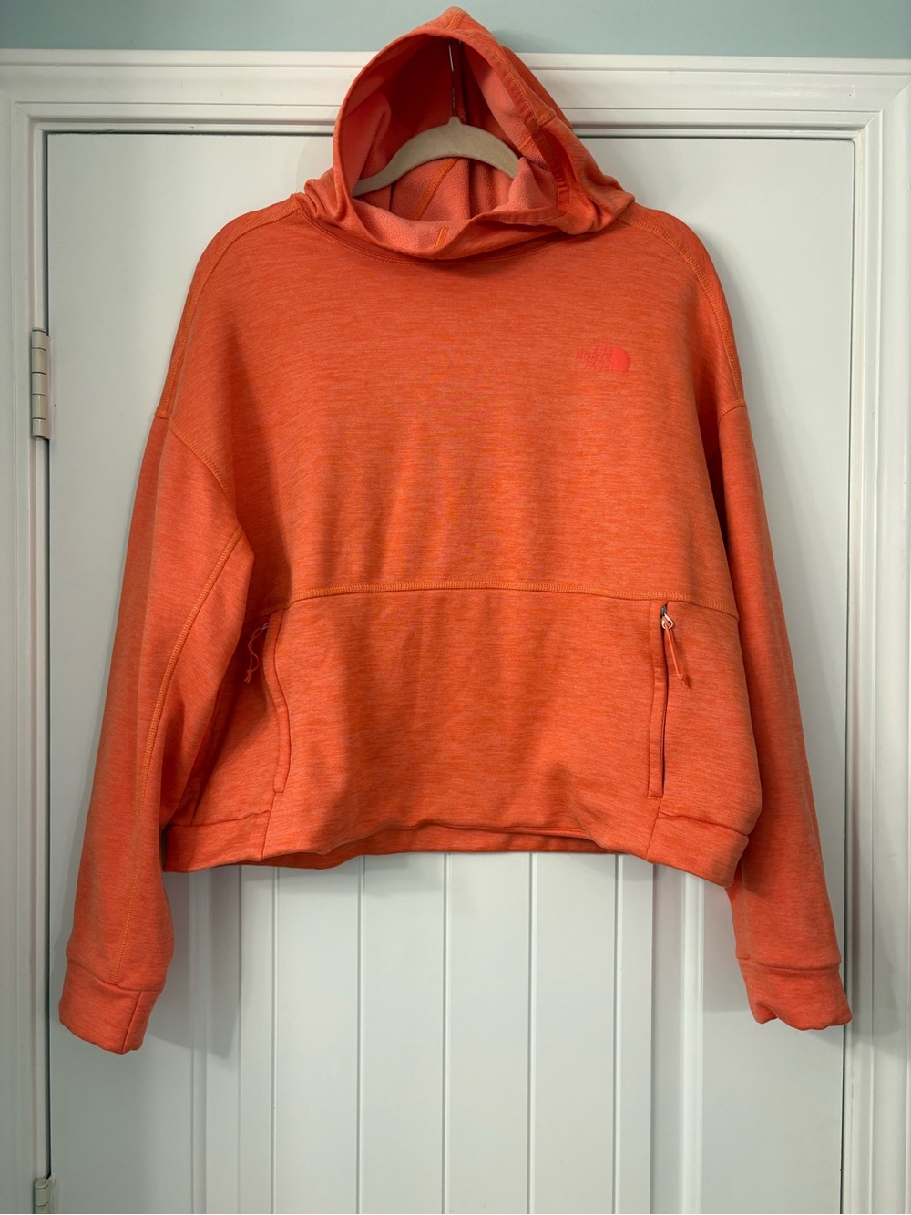 The North Face Orange Hooded Sweatshirt with Zippered Pockets